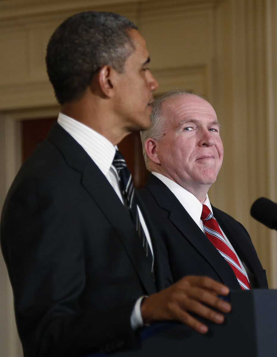 White House counterterrorism advisor John Brennan (R) listens as U.S. President Barack Obama nominates him to become the next CIA director at the White House in Washington January 7, 2013. Reuters.