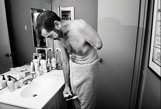 Television journalist, Miles O'brien, who lost an arm after an accident, gets ready for his day.