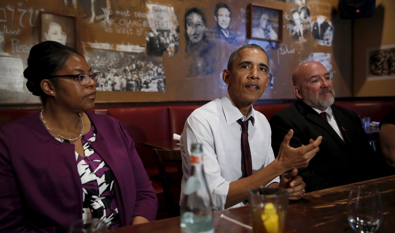 Obama with formerly incarcerated individuals who received commutations from his and previous administrations. March 30, 2016, DC.  With him, former inmates Romana Brant (L) and Phillip Emmert. REUTERS