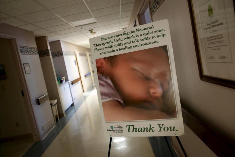 A sign marks the entrance to the Neonatal Therapeutic Unit at Cabell Huntington Hospital, where staff members have acted to treat an alarming number of drug-dependent newborns, in Huntington, West Virginia, October 19, 2015. REUTERS/Jonathan Ernst