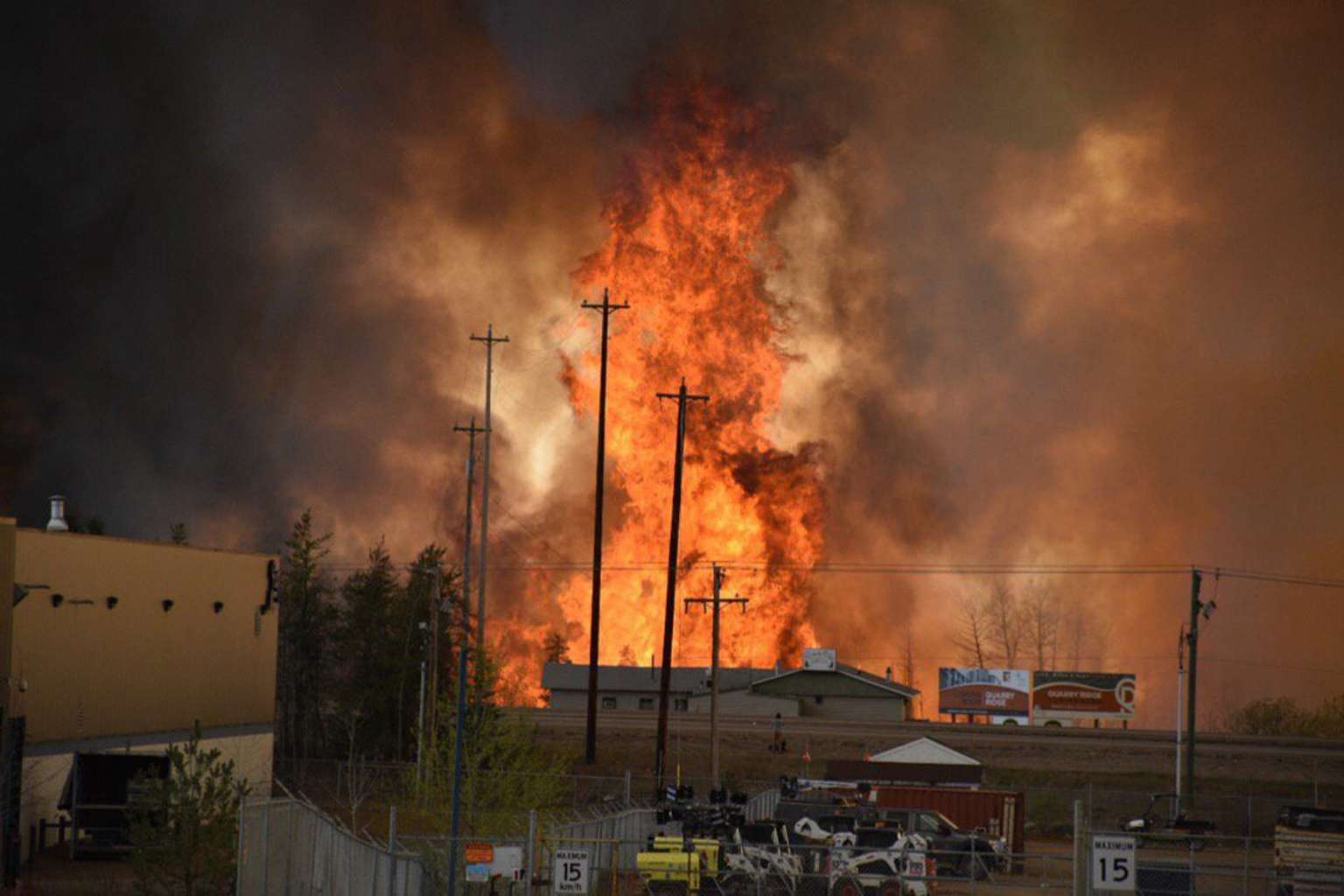 Flames rise in area south of Fort McMurray, Alberta May 3, 2016.  [Reuters]