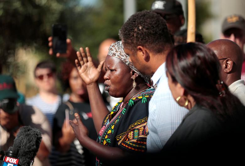 Agnes Hasam, a family friend of the late Alfred Olango, speaks to protesters at El Cajon Police HQ to protest the killing of an unarmed man Tuesday by officers. September 28, 2016. REUTERS