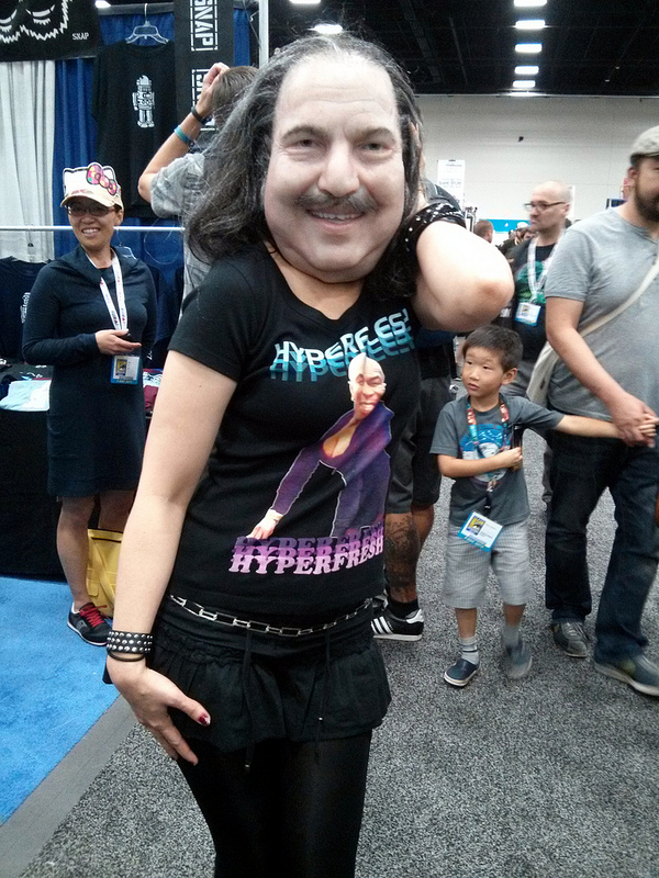 Cosplayer In A Realistic Ron Jeremy Mask Boi