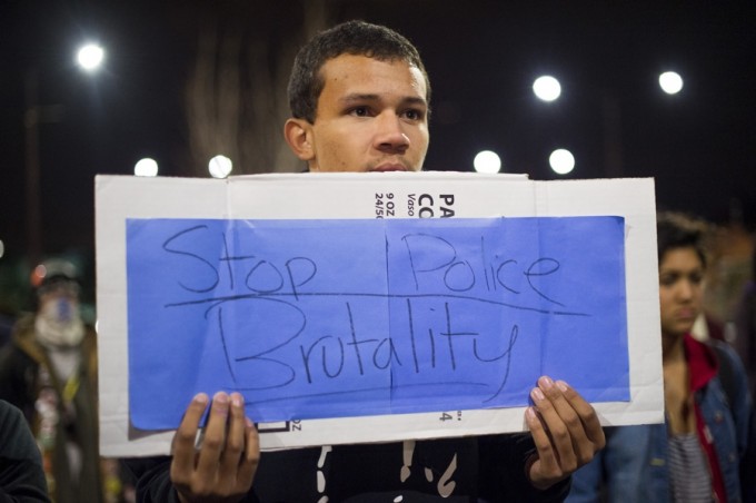 Bryan McKetney joins more than 100 protesters against police violence in Berkeley, California December 10, 2014. REUTERS/Noah Berger 