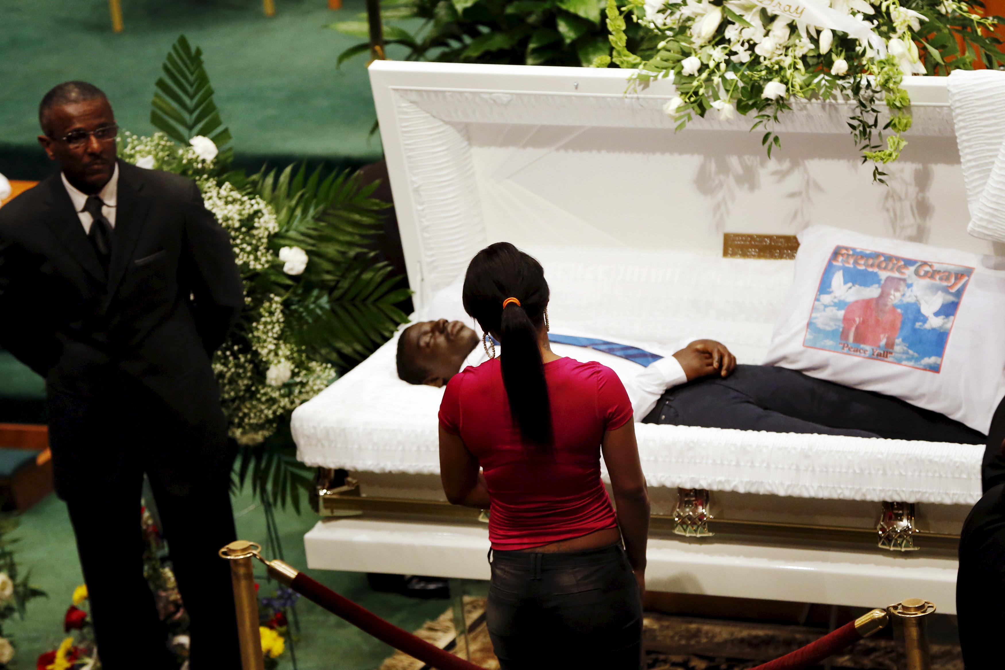 A Mourner Stands In Front Of Open Casket Of 25 Year Old Freddie Gray