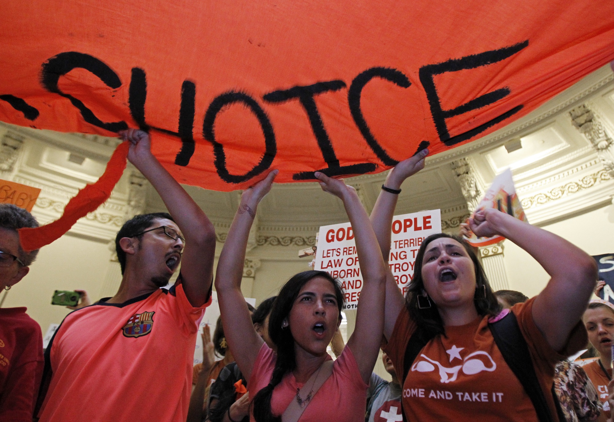 Protesters rally in the rotunda of the State Capitol in Austin, Texas July 12, 2013. REUTERS/Mike Stone