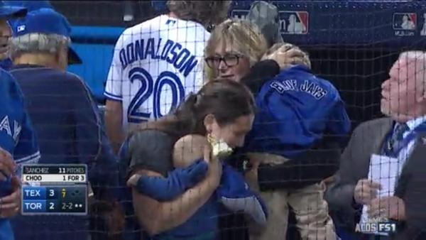 Beer from thrown can sprayed on this baby and mom at Toronto Blue Jays game.