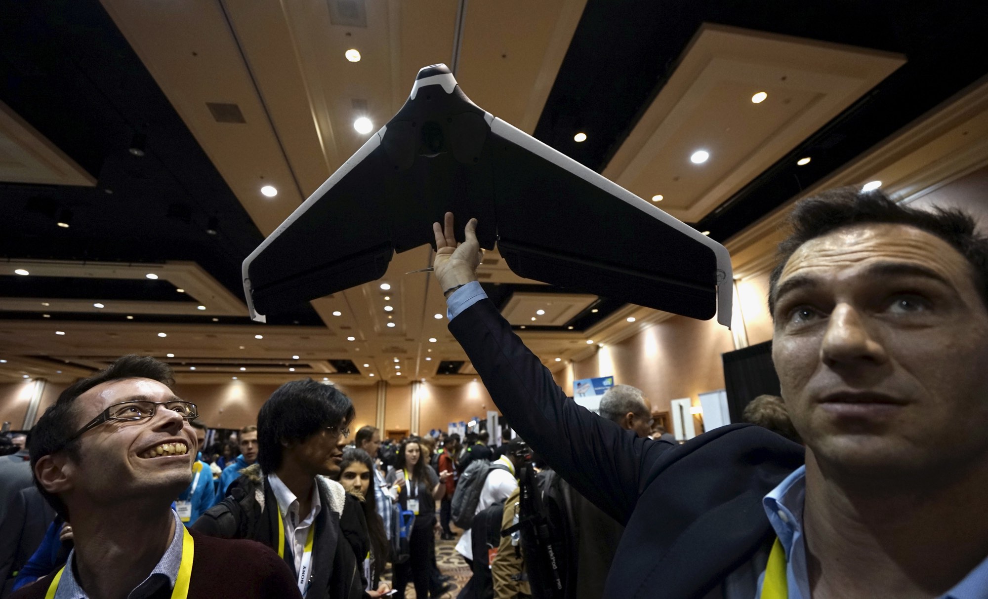 Representatives from the French company Parrot demonstrate a prototype of their new Disco drone at the opening event at CES 2016. The Disco is the first wing-shaped drone which a user can pilot with no learning process, according to the company. REUTERS