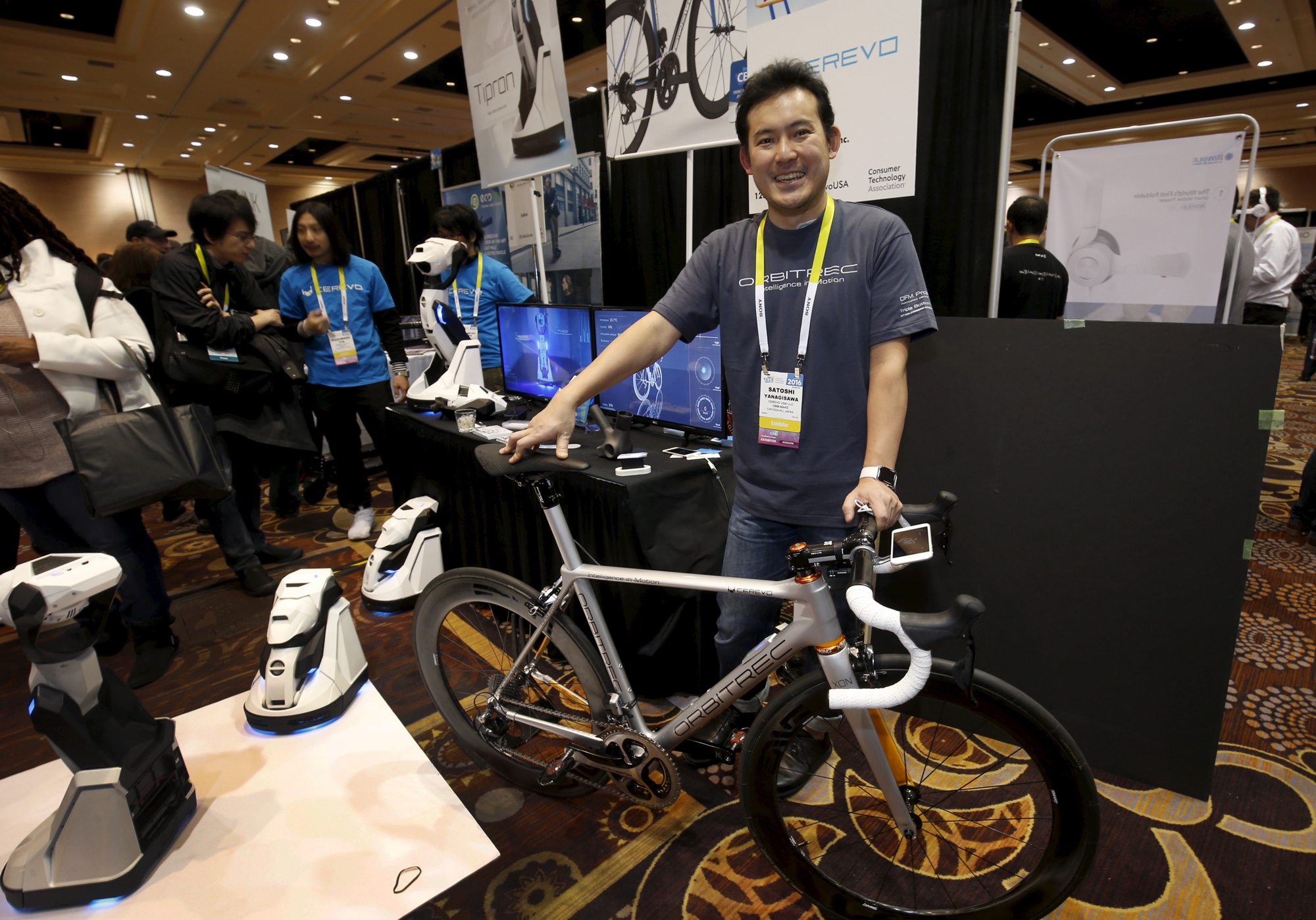 Satoshi Yanagisawa of Japan displays the Orbitrec, a connected 3D printed bicycle by Cerevo, during "CES Unveiled," a preview event of the 2016 International CES trade show, in Las Vegas, Nevada January 4, 2016. The bicycle features 3D printed titanium joints, carbon fiber tubes and a built in sensor module that sends a variety of information to a smartphone. REUTERS