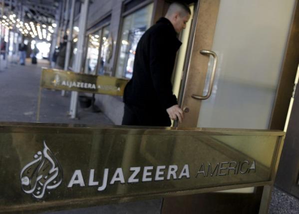 An employee enters the Al Jazeera America broadcast center NYC Jan 13, 2016.  REUTERS