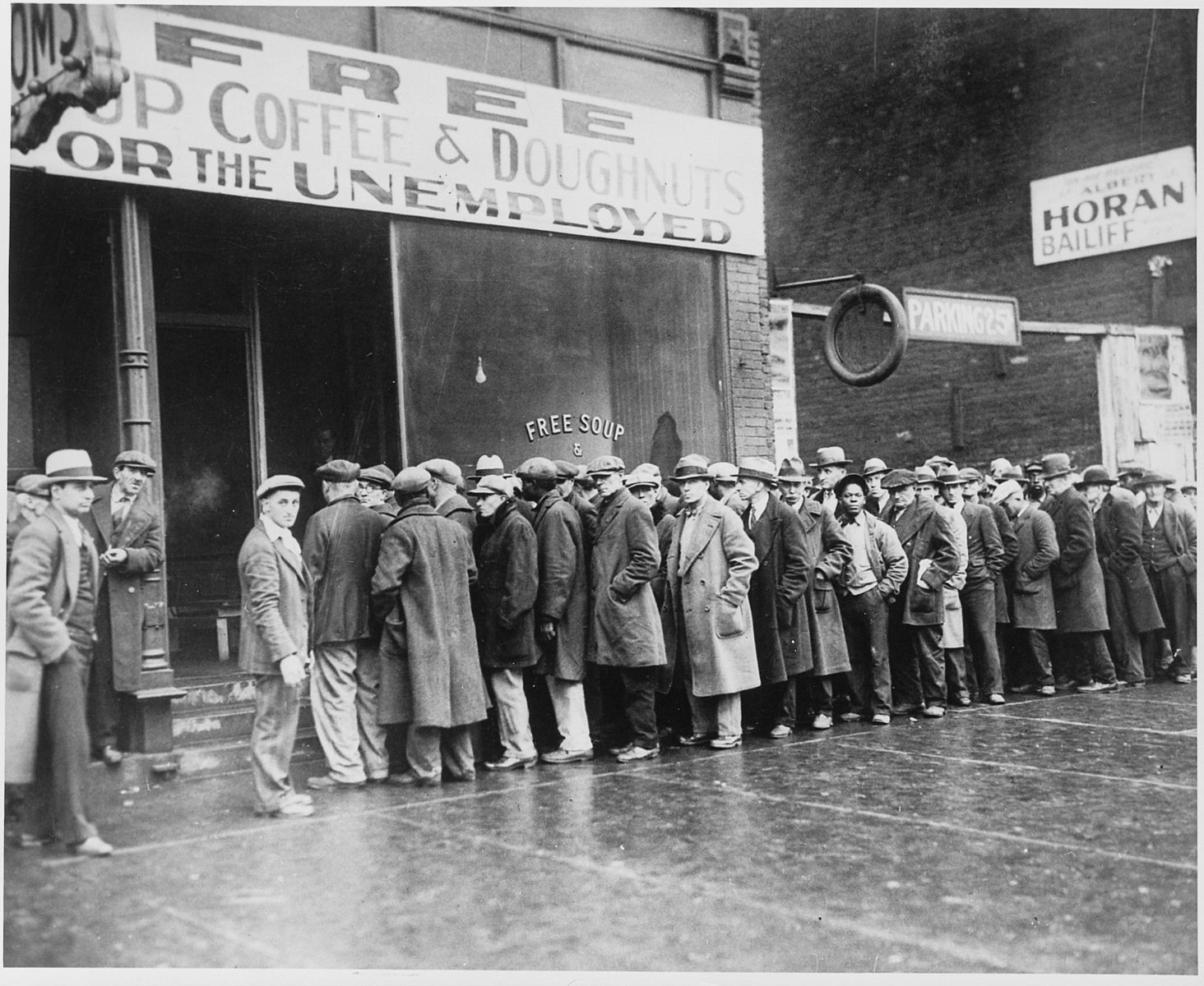 1464px-Unemployed_men_queued_outside_a_depression_soup_kitchen_opened_in_Chicago_by_Al_Capone,_02-1931_-_NARA_-_541927 (1)