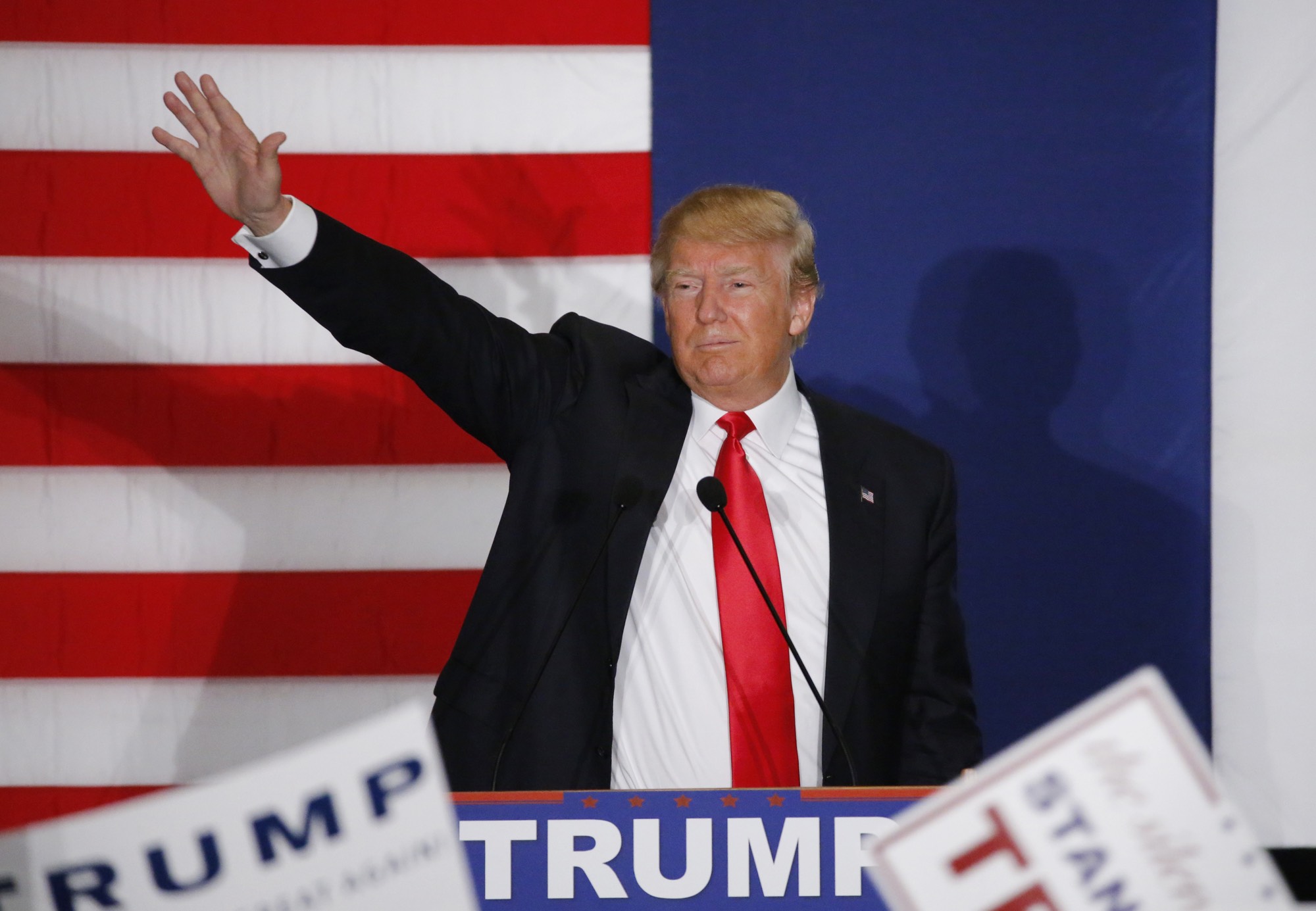 Donald Trump waves during a campaign rally in Cedar Rapids, Iowa Feb. 1, 2016. REUTERS