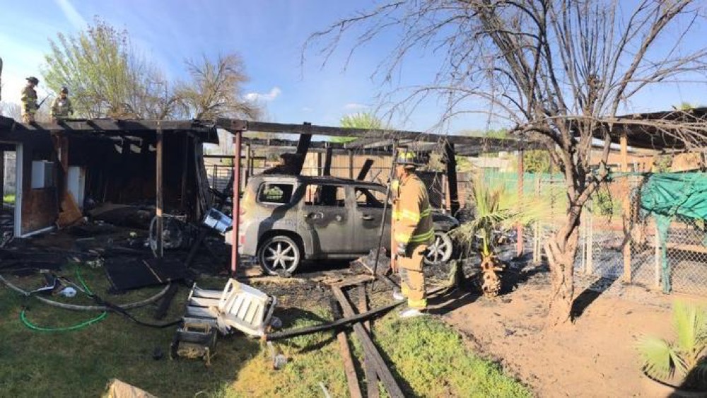 A mirrored headboard started a carport fire in Fresno, fire officials said. (Fresno FD)