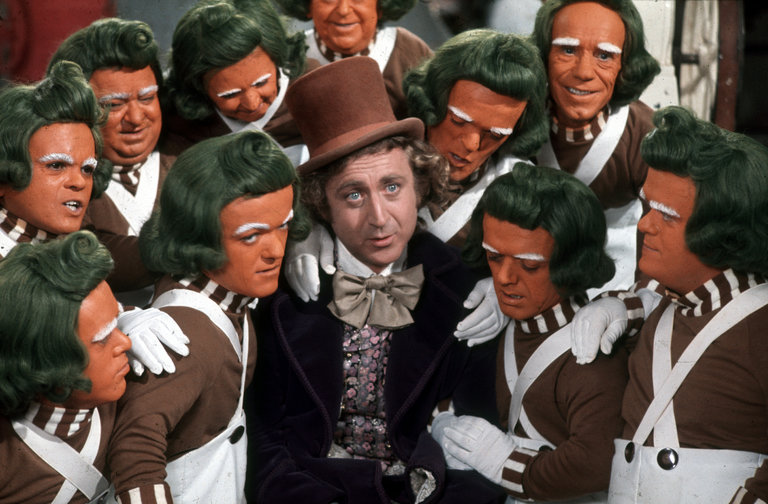 Gene Wilder with Oompa Loompas in Willy Wonka and the Chocolate Factory. [Paramount Pictures]