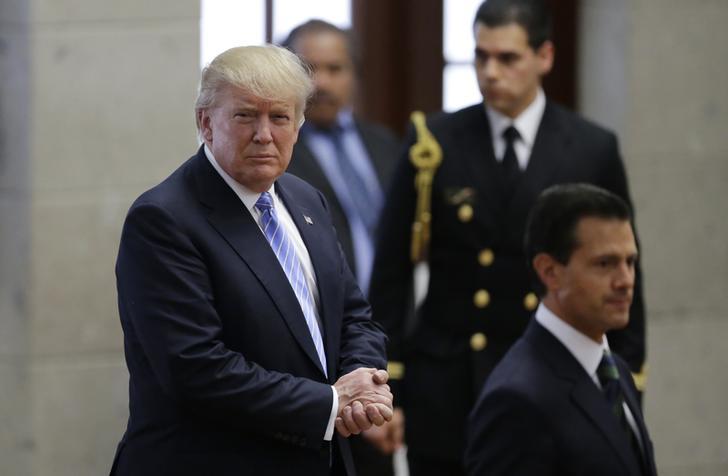 Donald Trump and Mexico's President Enrique Pena Nieto arrive for a press conference at the Los Pinos residence in Mexico City. REUTERS/Henry Romero