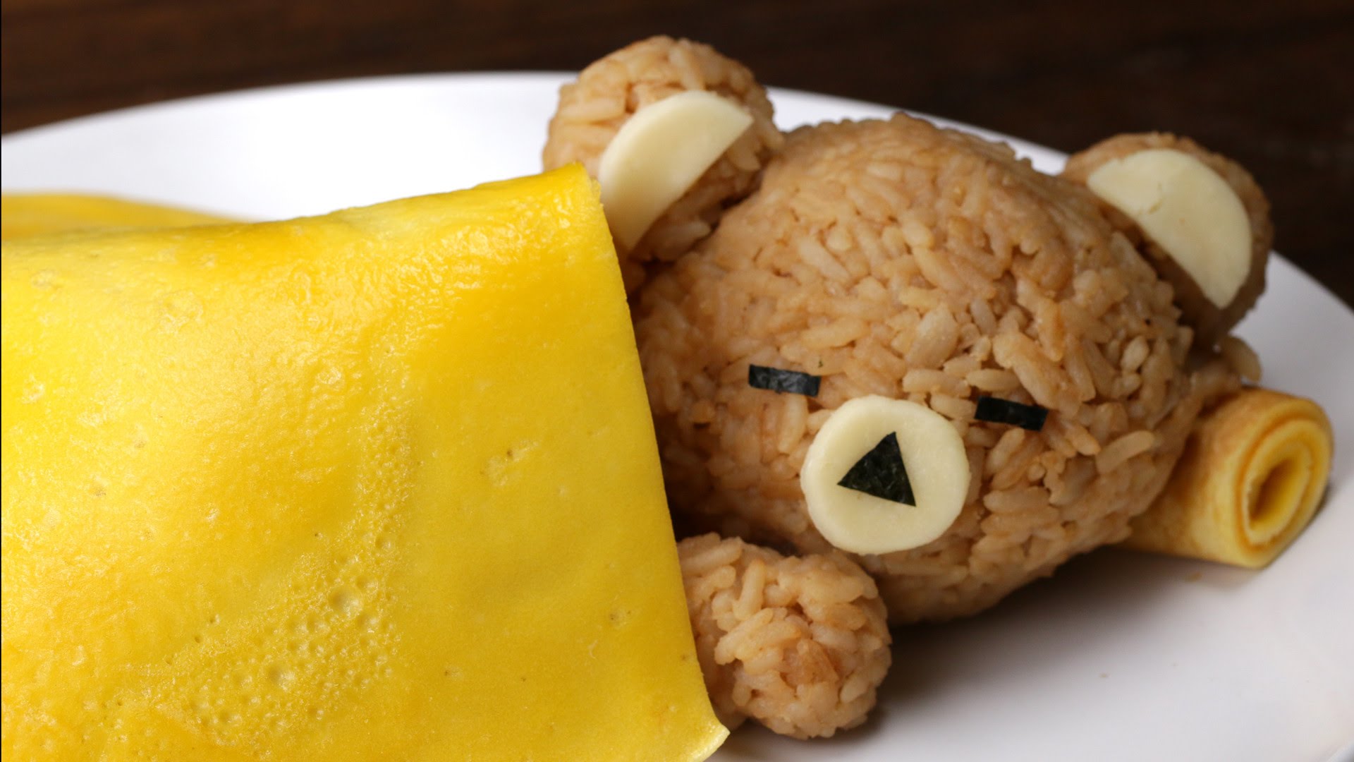 This Sleeping Rice Bear With An Egg Blanket Is Almost Too Cute To
