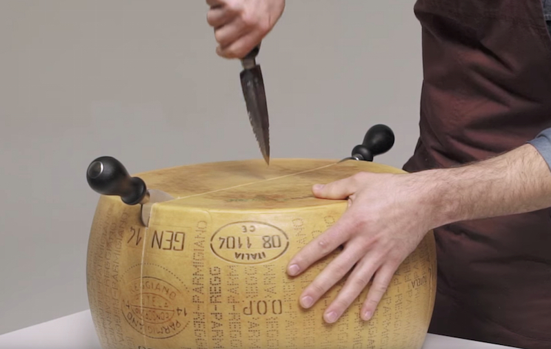 This video on how to cut a Parmigiano Reggiano cheese wheel is very