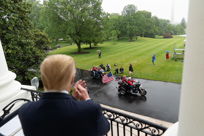 Donald Trump claps his tiny hands as veterans ride their motorcycles along the South Drive of the White House Friday, May 22, 2020, during the Rolling to Remember: Honoring Our Nations Veterans and POW-MIA event. (Official White House Photo by Shealah Craighead)